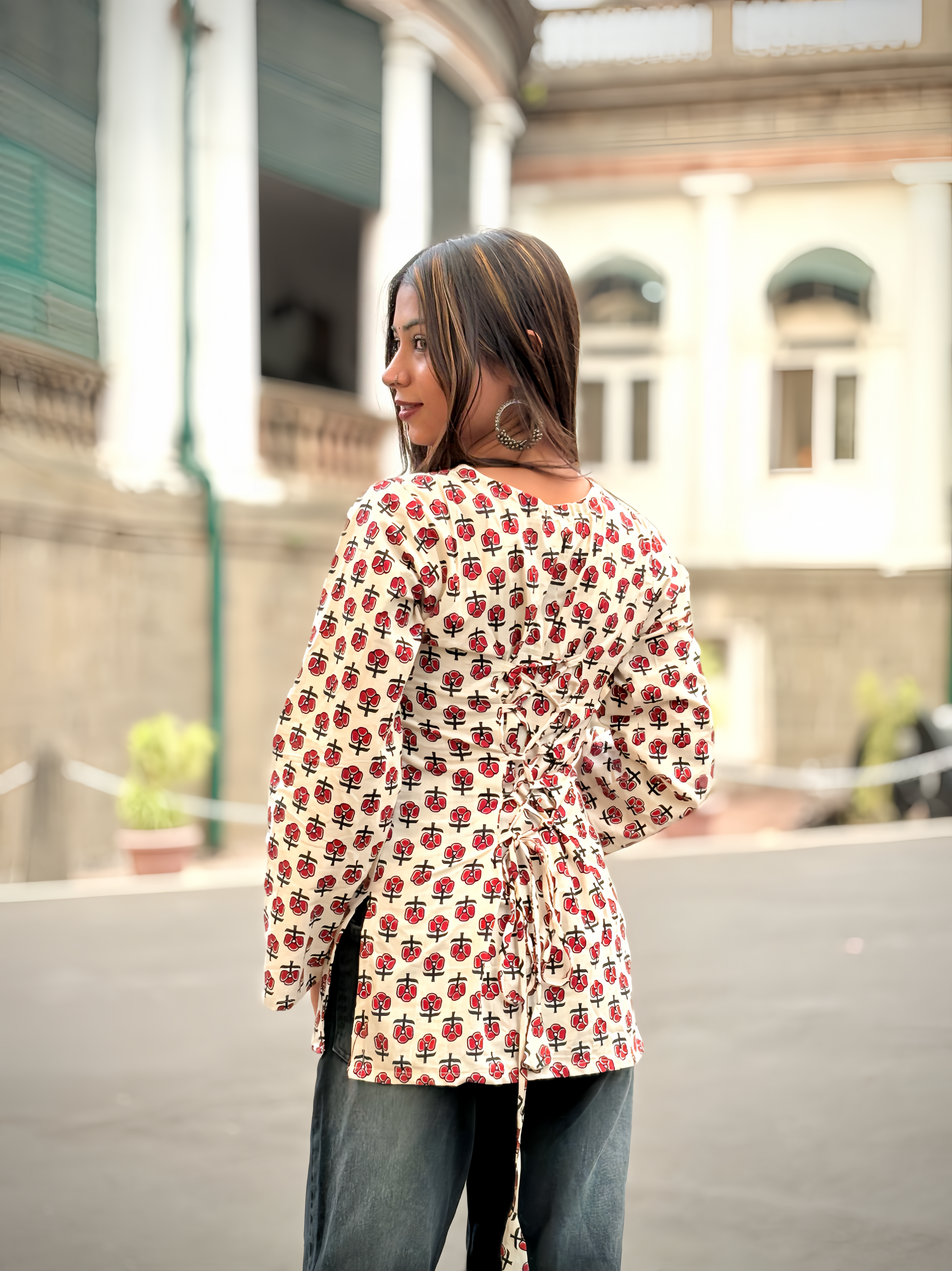 Girl wearing ivory red floral block-print top